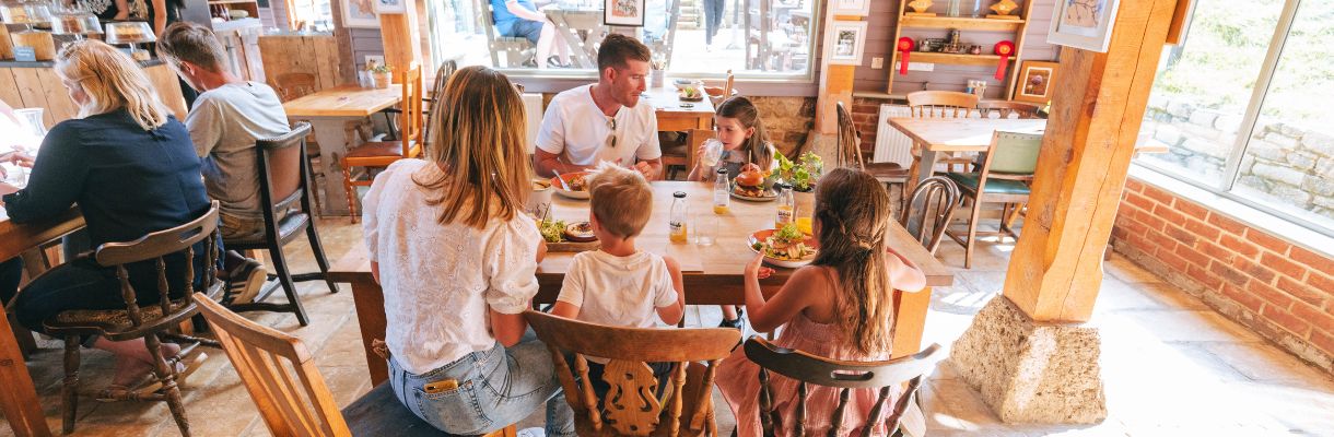 Family eating at The Garlic Farm, Isle of Wight